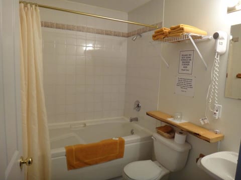 Bathtub, jetted tub, hair dryer, towels