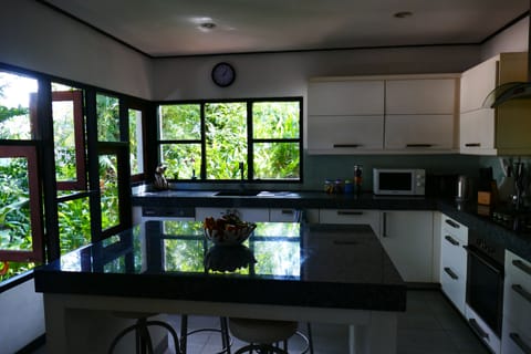 Spacious, modern  kitchen with Island and stools.