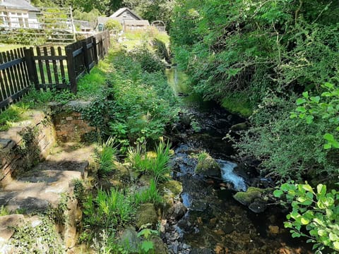The river with steps leading down if you want to paddle and cool your feet.