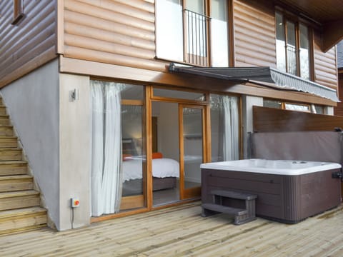Luxurious hot tub on the decked patio | Waterside Lodge Sixteen - Ashgrove Country Park, Elland