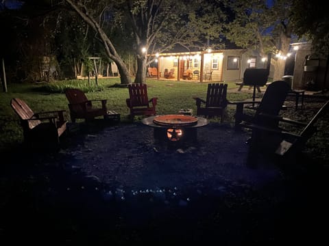 Fire-pit area with 6 Adirondack outdoor chairs. Smore's or just gathering around
