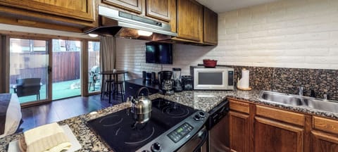 Double sink, full range, large fridge, dishwasher and all the appliances you see