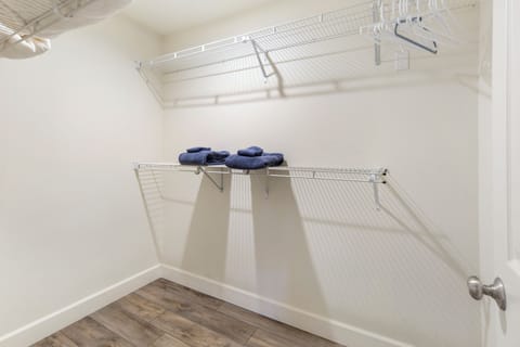 Primary Bedroom Walk in closet just off the ensuite, extra blankets and towels