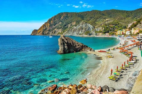 On the beach, sun loungers, beach towels