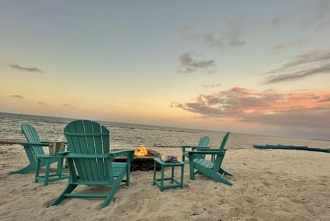 On the beach, sun loungers, beach towels