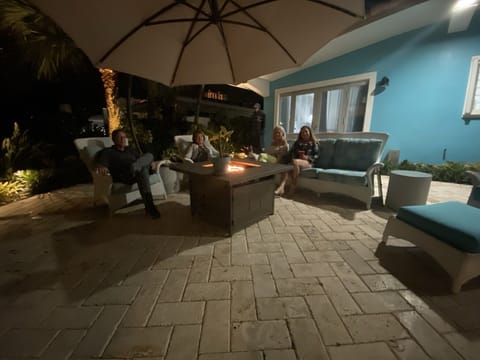 Five outdoor seating areas nicely placed around the home with three fire tables.