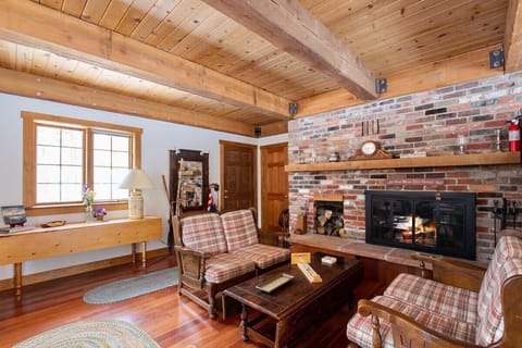 Living room: Wood-burning fireplace, Smart TV, forced heat, no A/C
