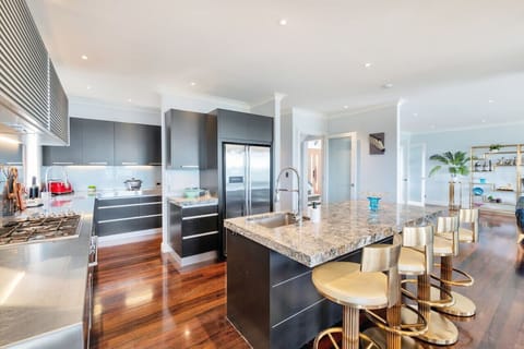 The kitchen is Chef’s dream: a gas cooktop, oven, double-door fridge/freezer, and butler`s pantry.