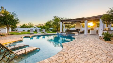 Luxury backyard w/ pool, spa, outdoor kitchen, & games