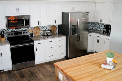 Large Kitchen. Stainless appliances. Granite counters. Big island. Lake views.