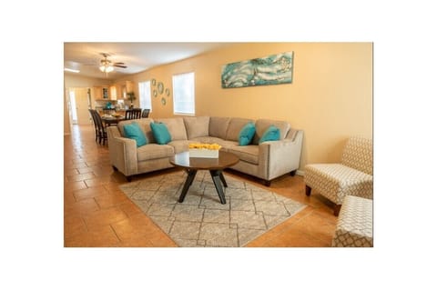 Open floorplan with spacious living and dining room. Sitting room for 8