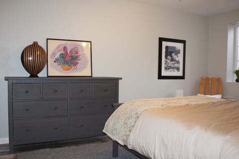 Bedroom - Dresser and queen-sized bed