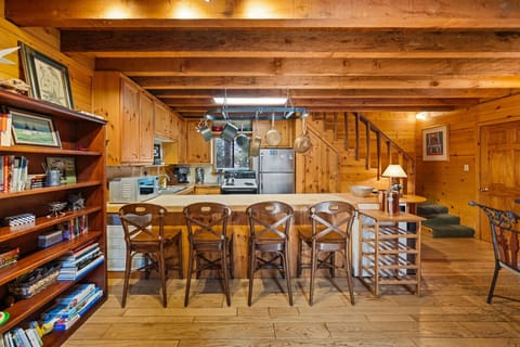 Kitchen with counter seating and there is additional dining seat - Kitchen with counter seating and there is additional dining seating in lliving room area.