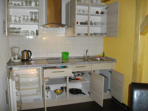 Fridge, stovetop, toaster, cookware/dishes/utensils