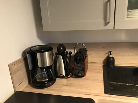 Microwave, dishwasher, coffee/tea maker, cookware/dishes/utensils