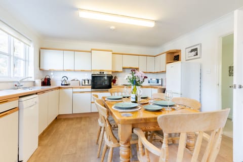 Above the Beach, First Floor: Kitchen area with an oven, hob, fridge/freezer, microwave, coffee machine and dishwasher