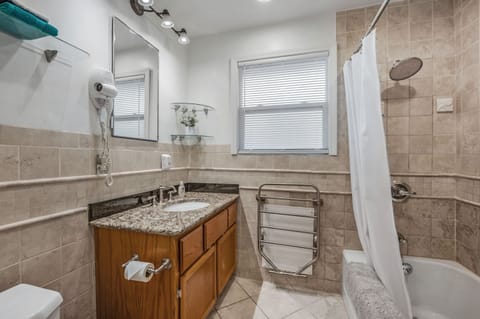 Combined shower/tub, hair dryer, towels, soap