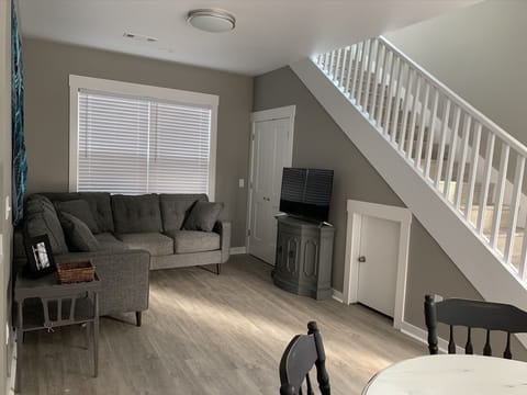 Living Room with stairwell going to bedrooms/bathroom