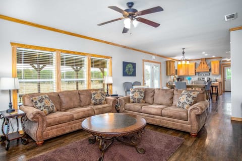 With super-comfortable furniture and a spacious open-floor plan, everyone's part of the conversation between the living area, dining area, and kitchen.