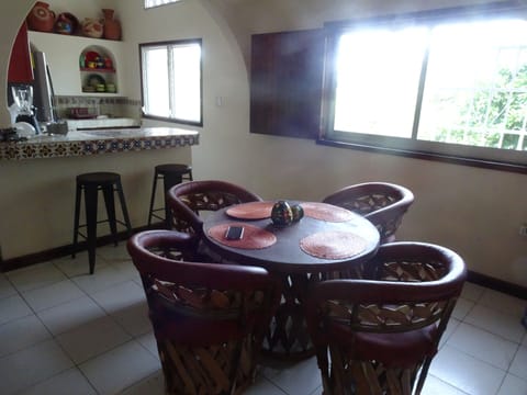 Dining table and stools ar the kitchen bar