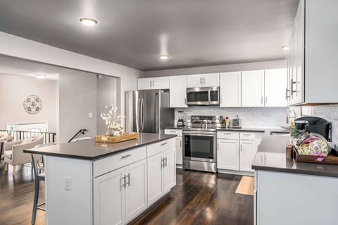 Kitchen with Blender, Toaster, Keurig, Dishes, and Cooking Pans