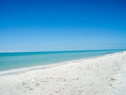 On the beach, sun loungers, beach towels