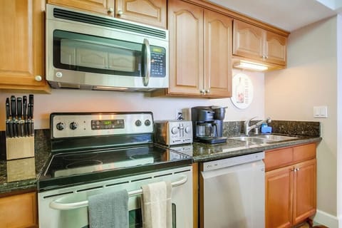 Kitchen with stainless steel appliances, and all you need for meals at home!