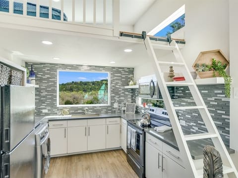 Ladder to loft. Two foam twin mattresses on loft