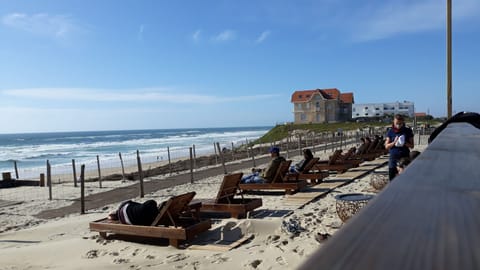 On the beach, sun loungers