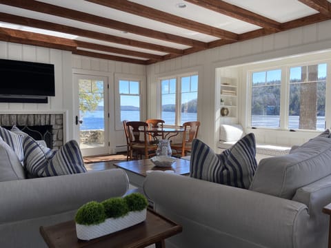 The living room feels perched on the lake and has expansive views.