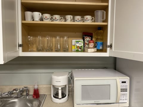 Fridge, microwave, stovetop, coffee/tea maker