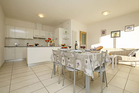 The living room with kitchen corner and dinner table
