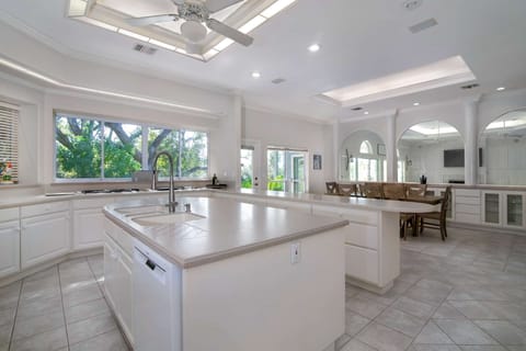 Kitchen and dining share open area with lots of natural light, and access to the back yard and sunroom.
