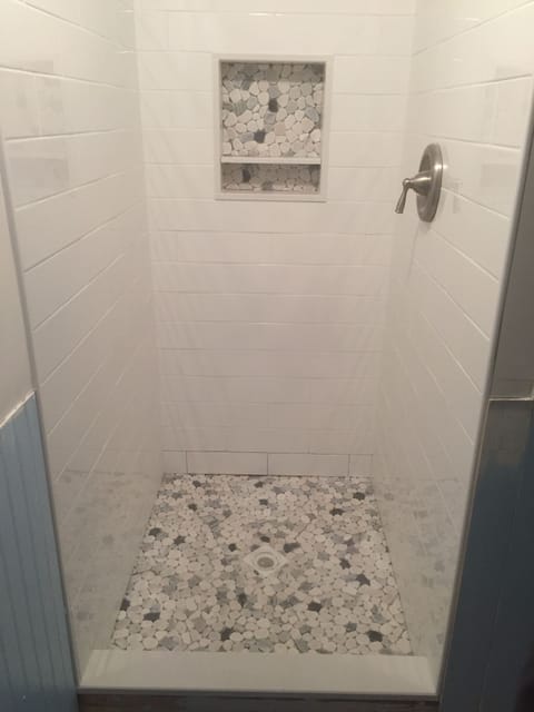 Combined shower/tub, hair dryer, towels, soap