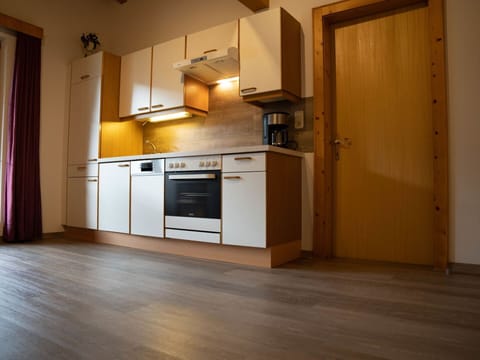 Countertop, Cabinetry, Building, Kitchen Appliance, Home Appliance, Kitchen Stove, Kitchen, Wood, Stove, Curtain