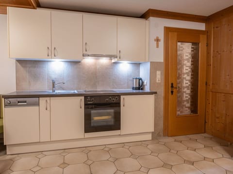 Flooring, Countertop, Kitchen, Interior Design, Wood, Cabinetry, Floor, Furniture, Kitchen Appliance, Ceiling