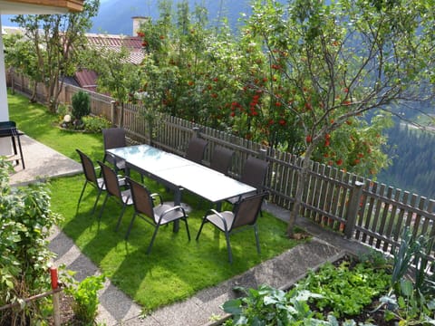 Plant, Flower, Table, Property, Furniture, Building, Tree, Outdoor Furniture, Outdoor Table, Shade