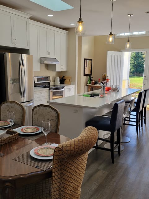 Kitchen and dining area view. Table seats 6 and island seats 5. 