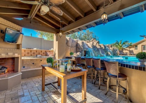 Great place to gather while your friends and family are enjoying the pool.