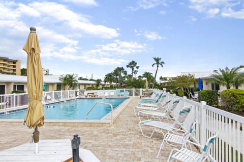 A heated pool, sun loungers