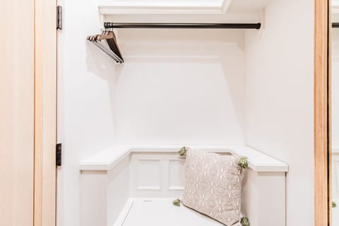 There's even a sweet bench in the closet!