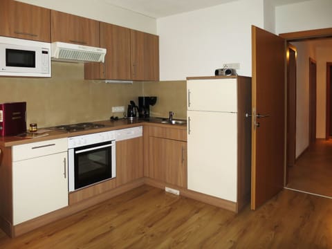 Room, Cabinetry, Kitchen, Major Appliance, Countertop, Furniture, Property, Floor, Microwave Oven, Hardwood