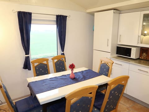 Furniture, Property, Table, Chair, Wood, Curtain, Interior Design, Comfort, Flooring, Window