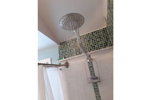 Combined shower/tub, hair dryer, towels, soap