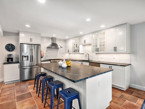 Oversized chef's kitchen with large gathering island