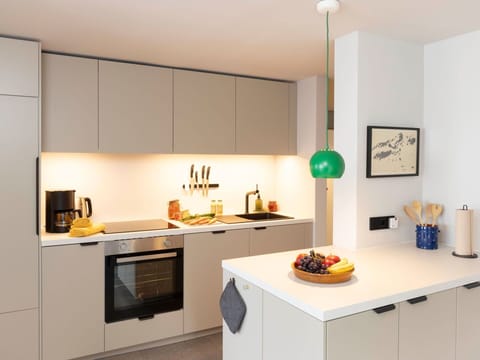 Kitchen, Countertop, Interior Design, Kitchen Appliance, Furniture, Cabinetry, Flooring, Wood, Major Appliance, Light Fixture