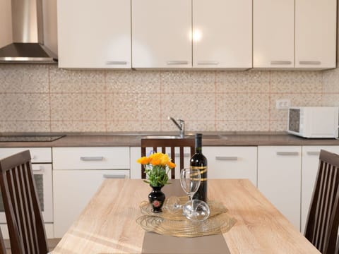 Kitchen, Countertop, Cabinetry, Kitchen Appliance, Furniture, Interior Design, Wood, Flooring, Major Appliance, Sink