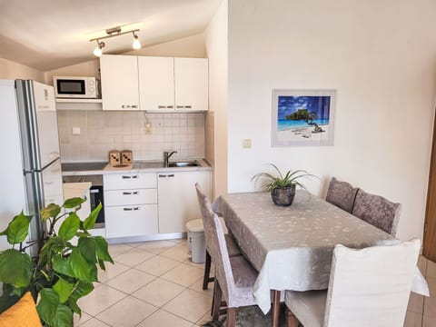 Cabinetry, Furniture, Countertop, Property, Plant, Houseplant, Flowerpot, Chair, Drawer, Couch