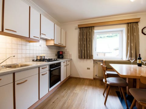 Room, Property, Furniture, Countertop, Kitchen, Cabinetry, Interior Design, Building, Floor, Yellow