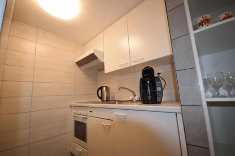 Fridge, stovetop, coffee/tea maker, toaster